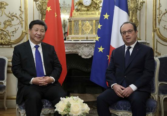 11月29日，国家主席习近平在巴黎会见法国总统奥朗德。新华社记者 兰红光 摄