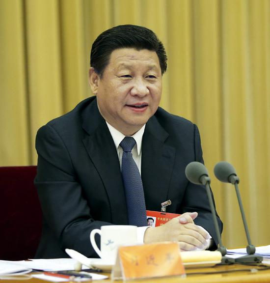 图为：2014年12月9日至11日，中央经济工作会议在北京举行。习近平发表重要讲话。