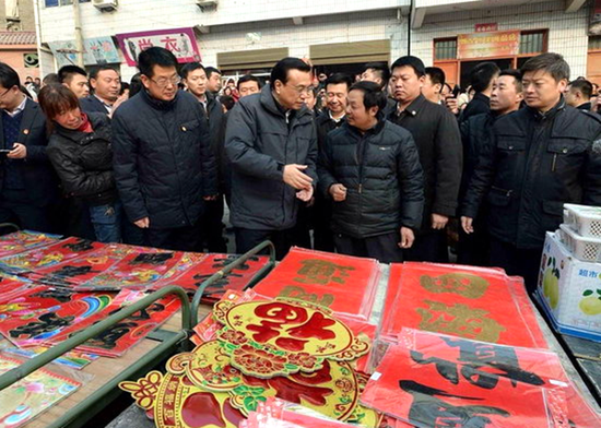 2014年1月，李克强到陕西省安康市旬阳小河镇集贸市场考察。新华社记者李涛摄 
