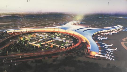 重庆江北机场东航站区及第三跑道工程效果图（翻拍）。　刘贤　摄