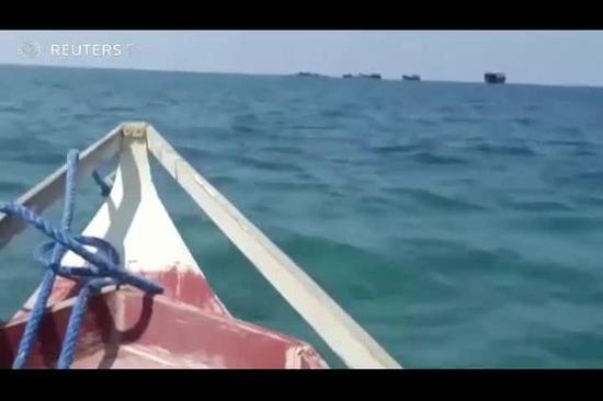 路透社记者深入南海报道：中菲渔船一片和谐
