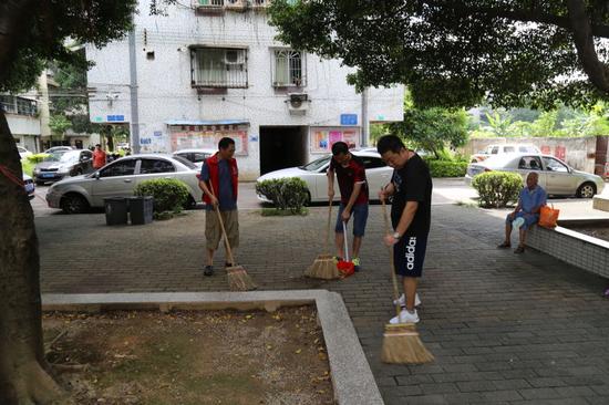 江门市司法局积极开展创文志愿者服务活动|江