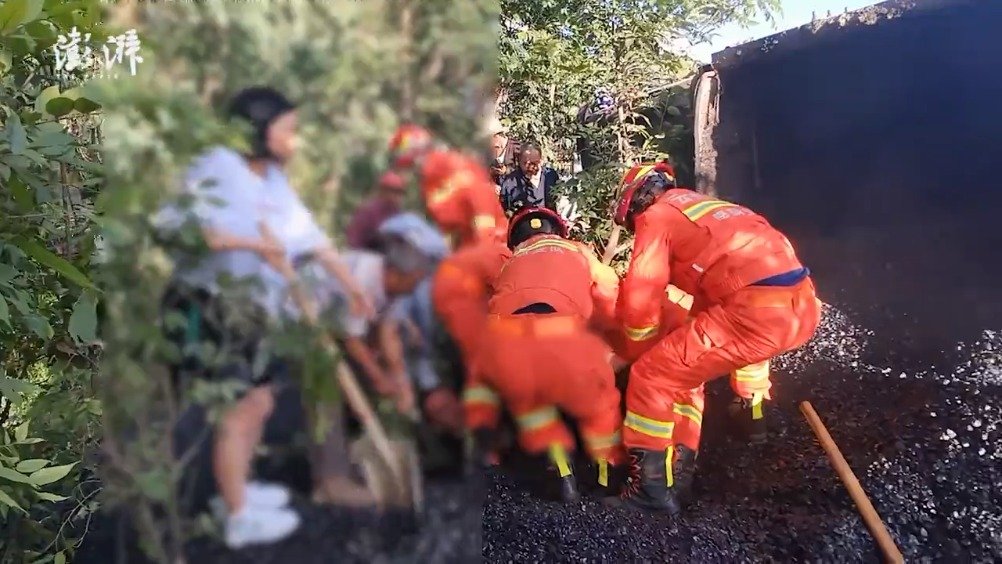 货车侧翻男子被埋沥青下