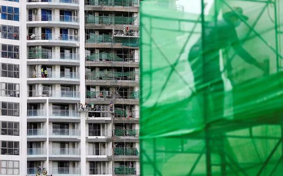 ▲当地时间2018年8月,柬埔寨金边一建筑工地。 图片来源:视觉中国