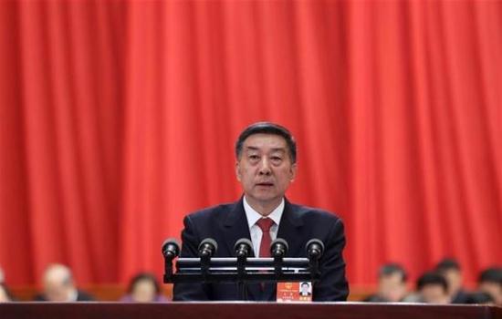 国务委员王勇向十三届全国人大一次会议作关于国务院机构改革方案的说明。新华网 图