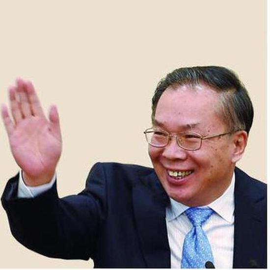 王国庆在2017年全国政协新闻发布会上答中外记者问。新华社资料图