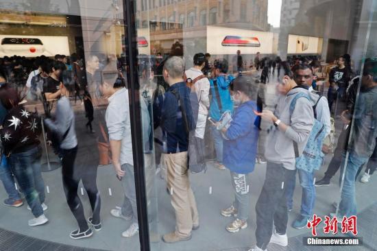资料图:一家苹果直营店内场景。殷立勤 摄