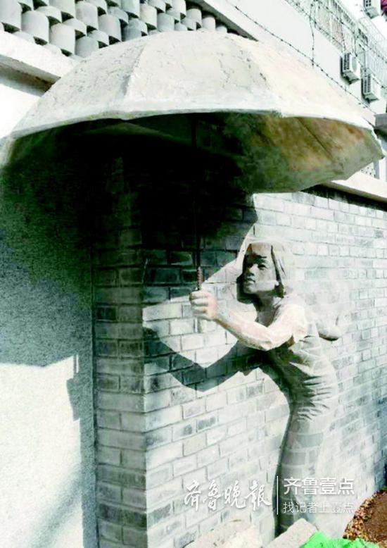 與墻體形成巧妙關(guān)系的青磚高浮雕。 齊魯晚報(bào)齊魯壹點(diǎn)記者 周青先 攝