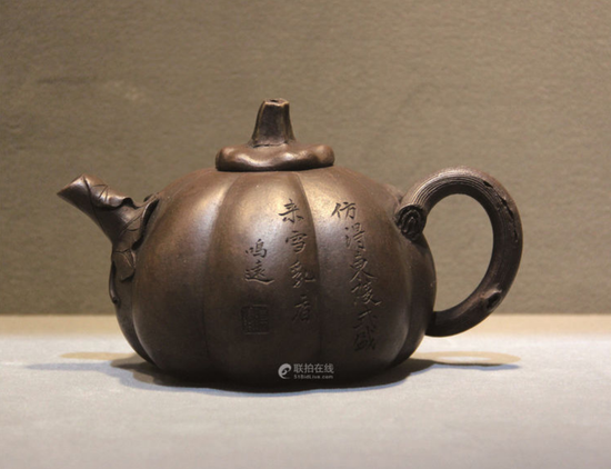 陈鸣远黑紫砂甜瓜壶