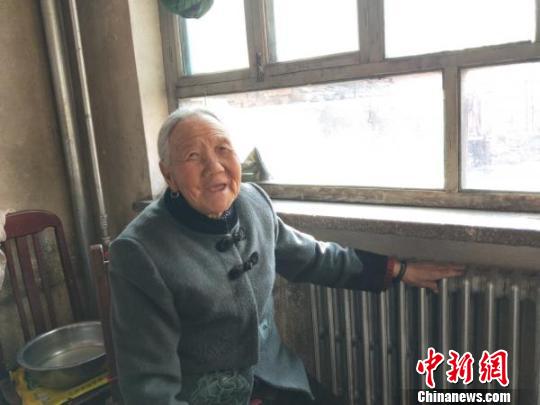 图为山西长治上党区享受到生物质能集中供热的村民。 李庭耀 摄