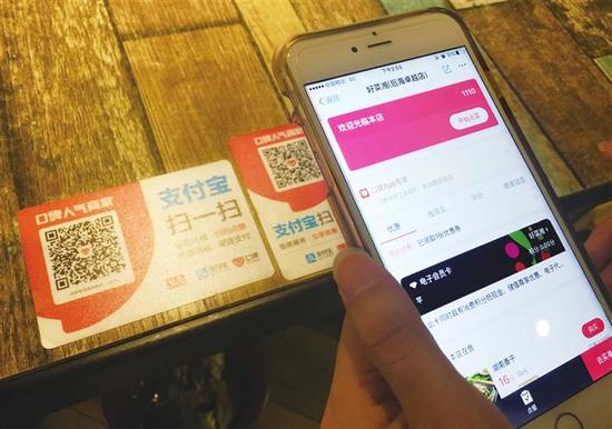 消费者扫描口碑码,便能点餐、结账,餐厅厨房便能实时收单。