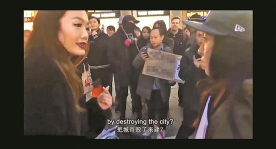 ▲班雅伦(左一)在德国科隆街头用中、英、德三种语言对峙香港示威者。 视频截图