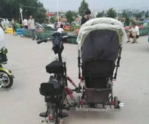网友爆料,近日在济宁街头发现一改装的电动车,旁边加装了一个婴儿车