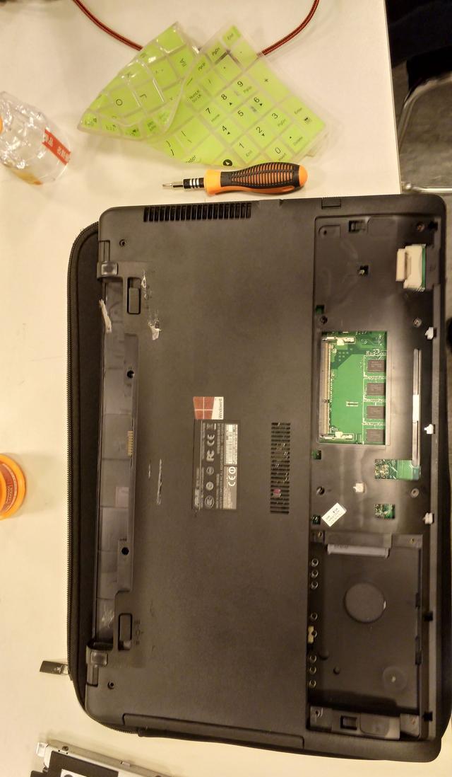 华硕笔记本fl5000c拆光驱装固态硬盘教程