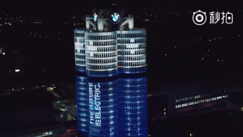米车生活 宝马为庆祝电动车销量超10万台，位于慕尼黑的宝马总部四缸大厦变...