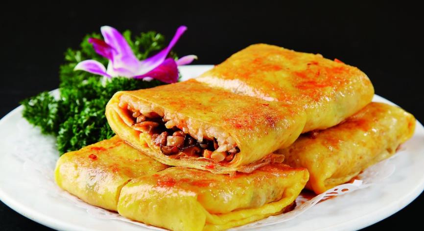 豆皮,是湖北省武汉市著名传统小吃,迄今已有50年的历史