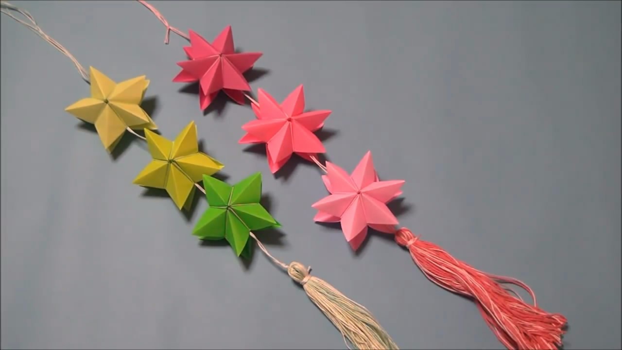 手工折纸制作浪漫的七夕装饰星,方法很简单,是不是很有创意