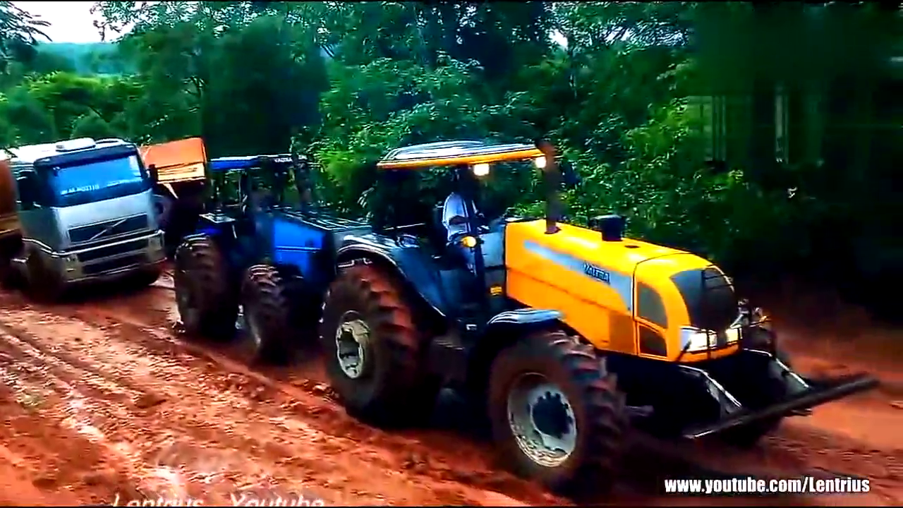 实拍卡车陷入泥中出不来，拖拉机来救援