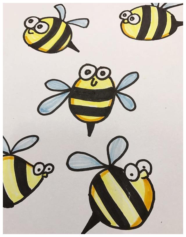 用水彩笔给蜜蜂上颜色.