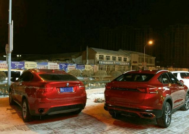 吉利FY11与宝马X6停在一起,都是红色,吉利FY11反而更霸气