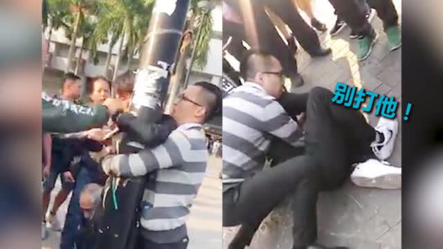 正义大叔出手制服黑衣暴徒 以德报怨保护他不被打(含视频)