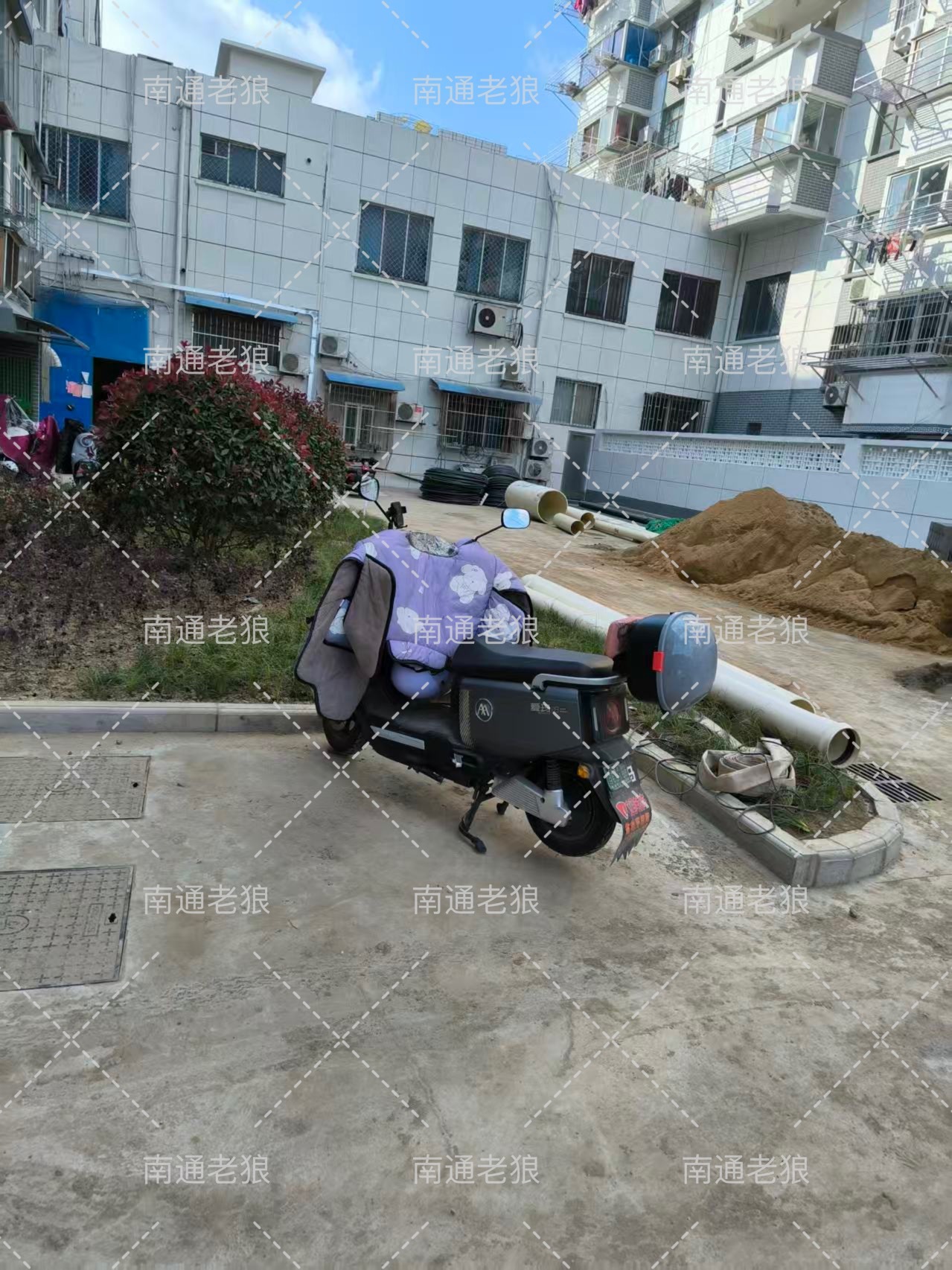 网友质疑华威园改造未装充电桩致飞线乱象