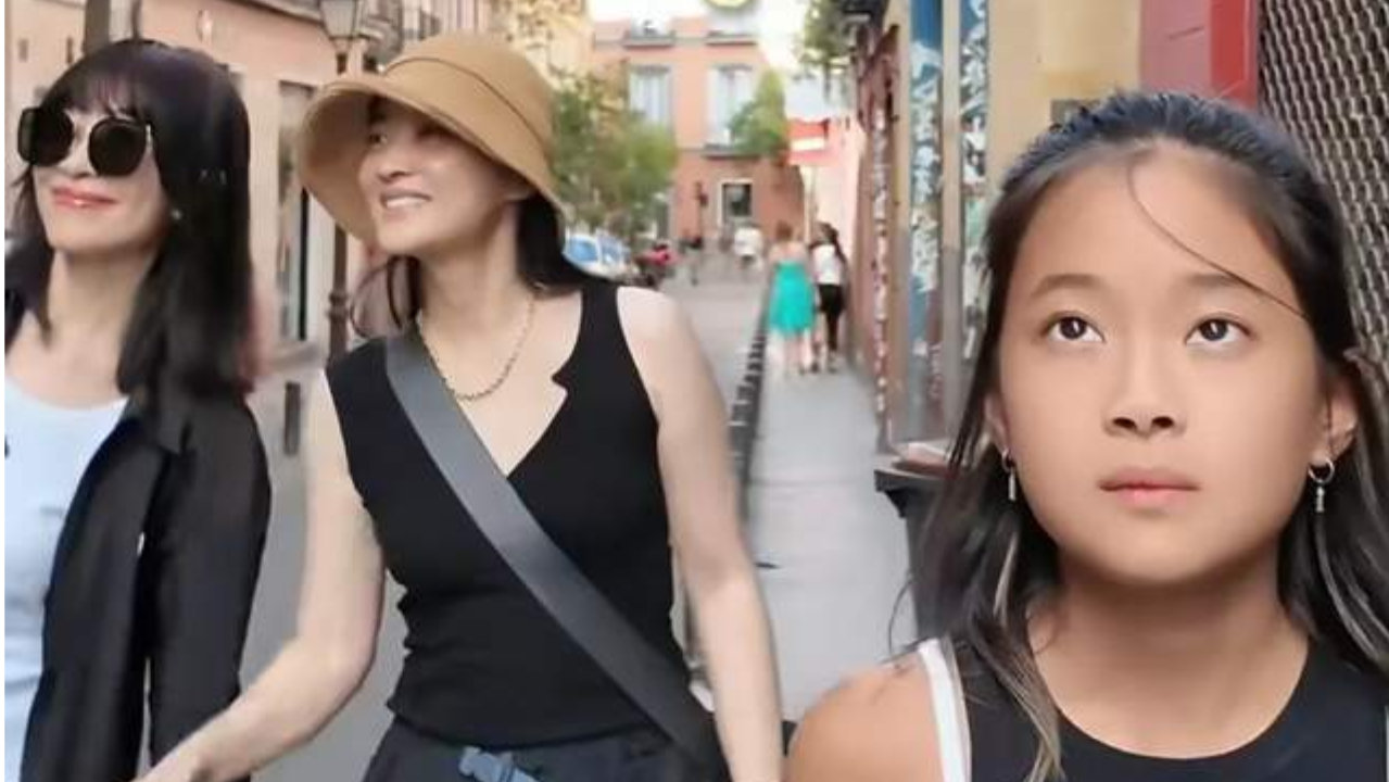 梅婷一家在西班牙度假，哥哥是大学老师担任翻译，嫂嫂比她还年轻