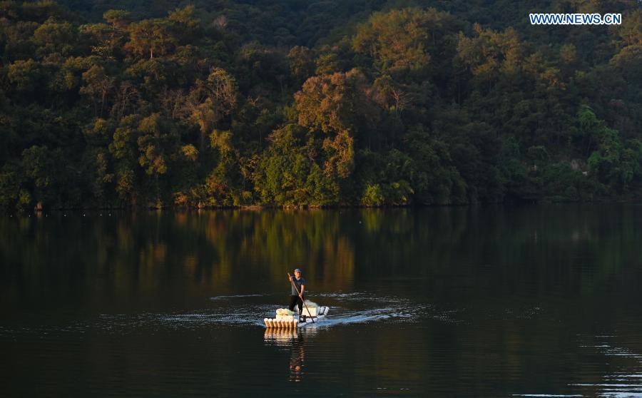 A villager paddles a raft in Changkou Village of Sanming, southeast China's Fujian Province, Nov. 20, 2020. For more than 20 years, Changkou Village has insisted on green development based on the resource advantages of local mountains, water and farmland. In 2019, the collective economic income of the village was 1.22 million yuan (about 185,550 U.S. dollars) and farmer's per capita disposable income reached 23,600 yuan. (Xinhua/Song Weiwei)