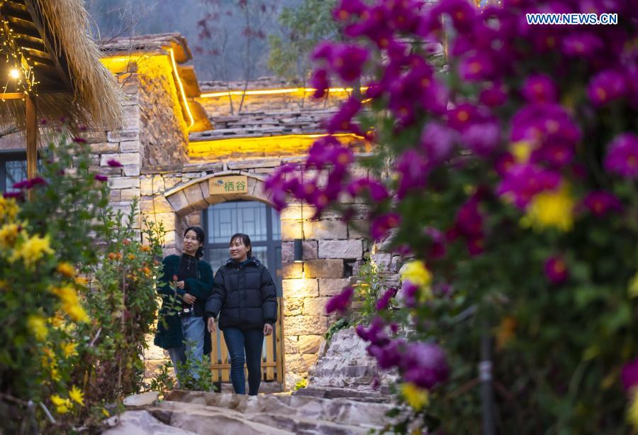Visitors tour a homestay at Huoshui Town in Wuan, north China's Hebei Province, Nov. 26, 2020. In recent years, based on its advantages of rural resources, Wuan City has built traditional villages with local characteristics to develop rural tourism. (Xinhua/Zhu Xudong)