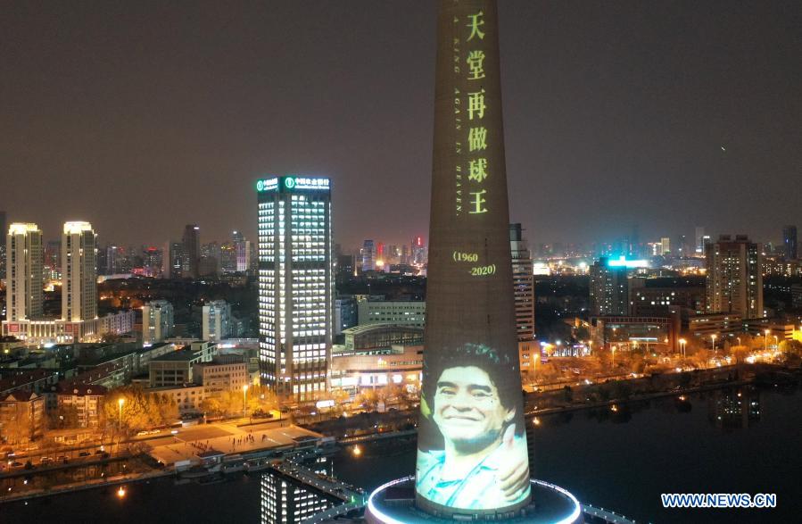 Aerial photo taken on Nov. 26, 2020 shows the image of football legend Diego Maradona projected on Tianjin TV Tower in north China's Tianjin Municipality. Maradona died at the age of 60 on Wednesday of a heart attack. (Xinhua/Li Ran)