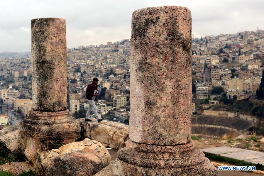 A tourist visits the Citadel archaeological site in Amman, capital of Jordan, Nov. 26, 2020. (Photo by Mohammad Abu Ghosh/Xinhua)