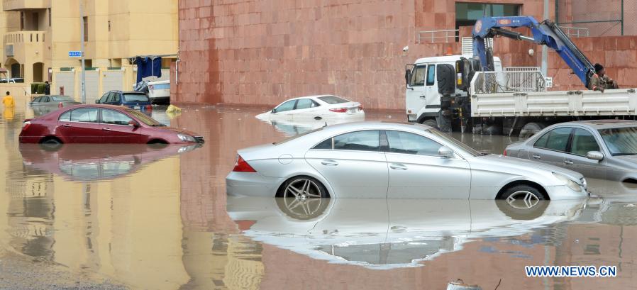 Vehicles are seen on a flooded street following heavy rains in Mubarak Al-Kabeer Governorate, Kuwait, on Nov. 29, 2020. Heavy rains hit Kuwait on Saturday evening and Sunday morning. (Photo by Asad/Xinhua)