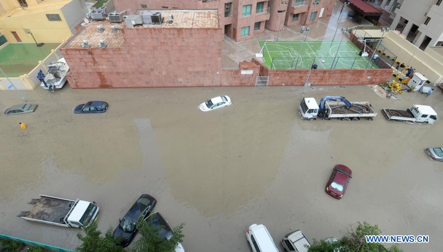 Vehicles are seen on a flooded street following heavy rains in Mubarak Al-Kabeer Governorate, Kuwait, on Nov. 29, 2020. Heavy rains hit Kuwait on Saturday evening and Sunday morning. (Photo by Asad/Xinhua)