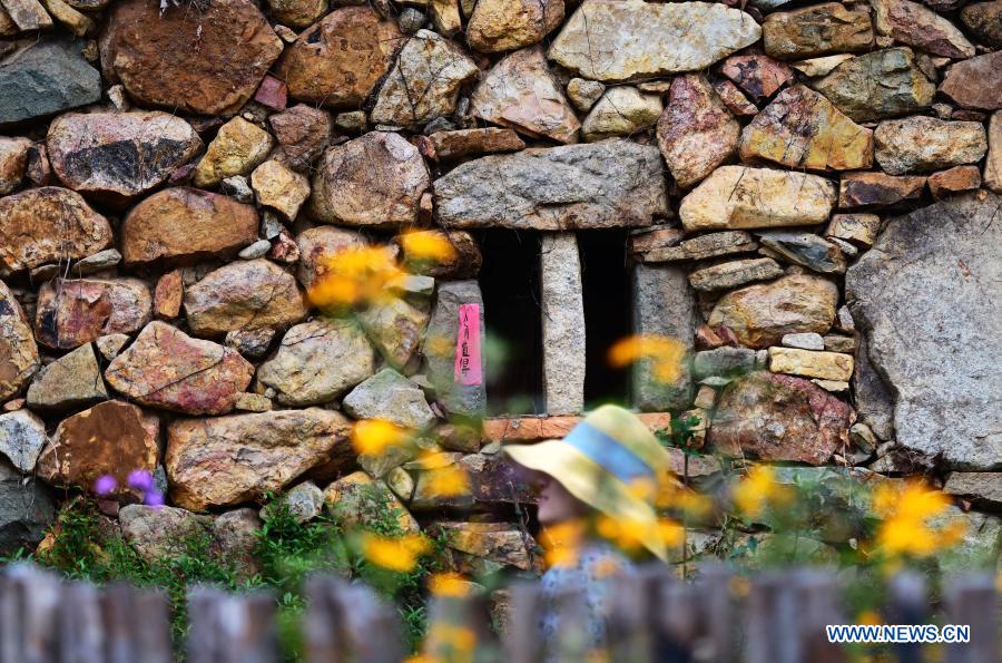 Photo taken on Dec. 1, 2020 shows a view of Zhangjiao Village in Tuling Township of Quan'gang District, Quanzhou City, southeast China's Fujian Province. Zhangjiao Village, located in the northwest mountainous area of Tuling Township, has a unique scenery with its stone houses stacked on top of each other. In recent years, Quan'gang District has made full use of the characteristic resources of Zhangjiao Village to develop ecological leisure tourism and promote the construction of beautiful countryside. (Xinhua/Wei Peiquan)