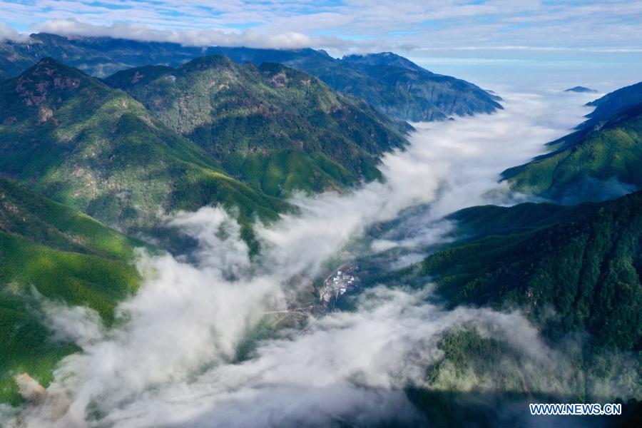 Aerial photo taken on Dec. 1, 2020 shows a cloud scenery at Wuyishan National Park, southeast China's Fujian Province. Wuyishan National Park is one of the country's 10 pilot national parks, with 210.7 square kilometers primary forest vegetation preserved here. (Xinhua/Jiang Kehong)