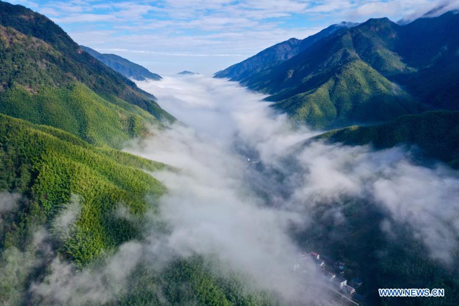 Aerial photo taken on Dec. 1, 2020 shows a cloud scenery at Wuyishan National Park, southeast China's Fujian Province. Wuyishan National Park is one of the country's 10 pilot national parks, with 210.7 square kilometers primary forest vegetation preserved here. (Xinhua/Jiang Kehong)