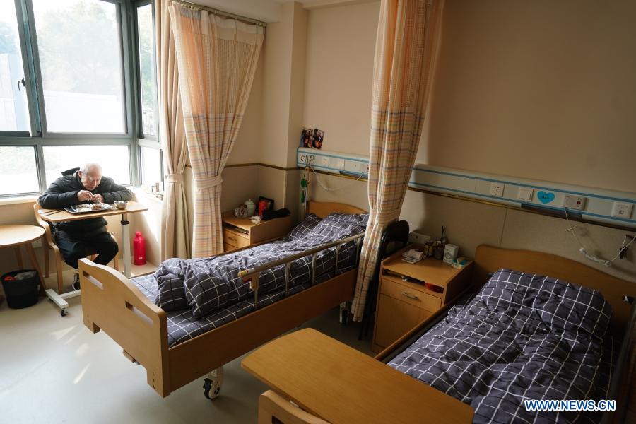 A senior resident has meal in his room at a community elderly care center at the Suzhou Industrial Park in Suzhou, east China's Jiangsu Province, Dec. 1, 2020. The elderly care center recently welcomed its clients back upon completion of a two-year renovation project that had fundamentally upgraded this facility from an ordinary nursing home. A professional management and operation team was also introduced to ensure quality services to the senior people living there. (Xinhua/Ji Chunpeng)