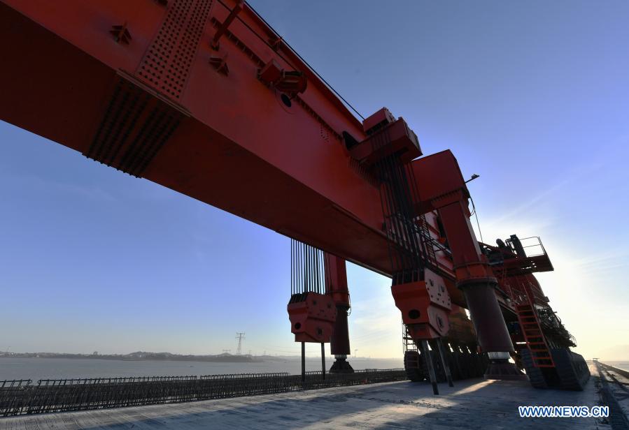 Photo taken on Dec. 2, 2020 shows the construction site of Meizhou Bay cross-sea bridge of the Fuzhou-Xiamen high-speed railway in southeast China's Fujian Province. The 14.7-km-long bridge is part of the province's Fuzhou-Xiamen high-speed railway, the first cross-sea high-speed railway in China, which is expected to be put into operation in 2022. (Xinhua/Wei Peiquan)