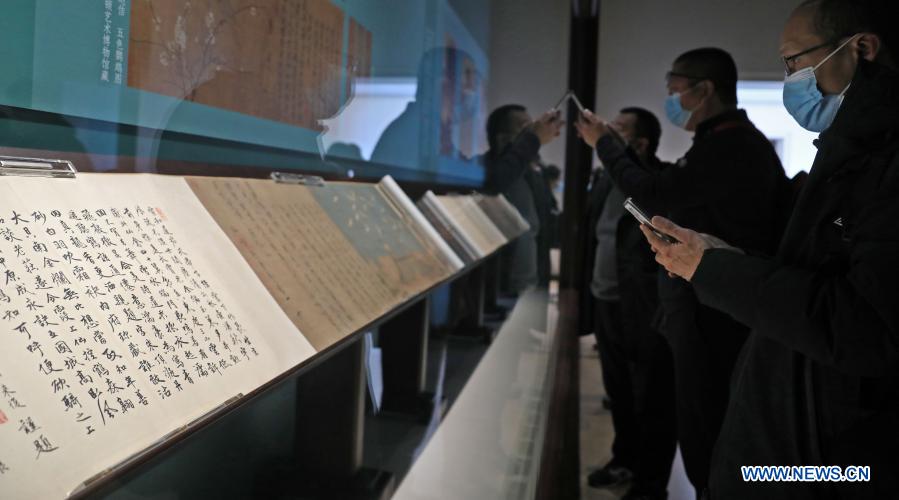 Visitors watch an exhibition of the Eight Great Masters of the Tang (618-907) and the Song (960-1279) Dynasties in the Liaoning Provincial Museum in Shenyang, northeast China's Liaoning Province, Dec. 4, 2020. The exhibition displays 115 exhibits, including calligraphy, paintings, inscriptions, rubbings, ancient books, among others, related to the eight masters who were renowned for their prose writing. (Xinhua/Yao Jianfeng)