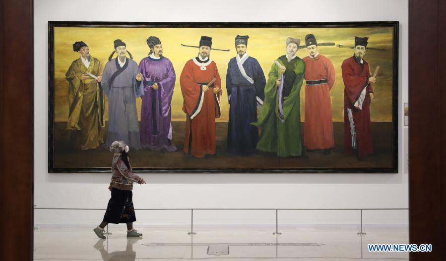 A visitor watches an exhibition of the Eight Great Masters of the Tang (618-907) and the Song (960-1279) Dynastiesin the Liaoning Provincial Museum in Shenyang, northeast China's Liaoning Province, Dec. 4, 2020. The exhibition displays 115 exhibits, including calligraphy, paintings, inscriptions, rubbings, ancient books, among others, related to the eight masters who were renowned for their prose writing. (Xinhua/Yao Jianfeng)