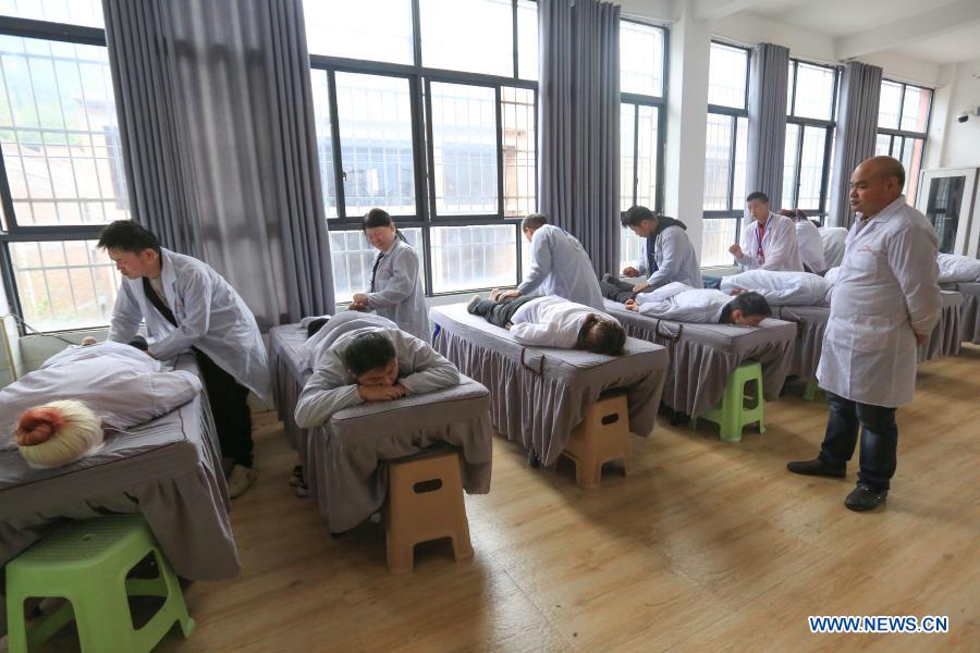 Trainees attend a skill training course at a school for blind persons in Qixingguan District of Bijie City, southwest China's Guizhou Province, Oct. 13, 2020. All 488,000 registered impoverished disabled people in Guizhou had been lifted out of poverty, data from provincial disabled persons' federation showed recently. (Photo by Wang Chunliang/Xinhua)