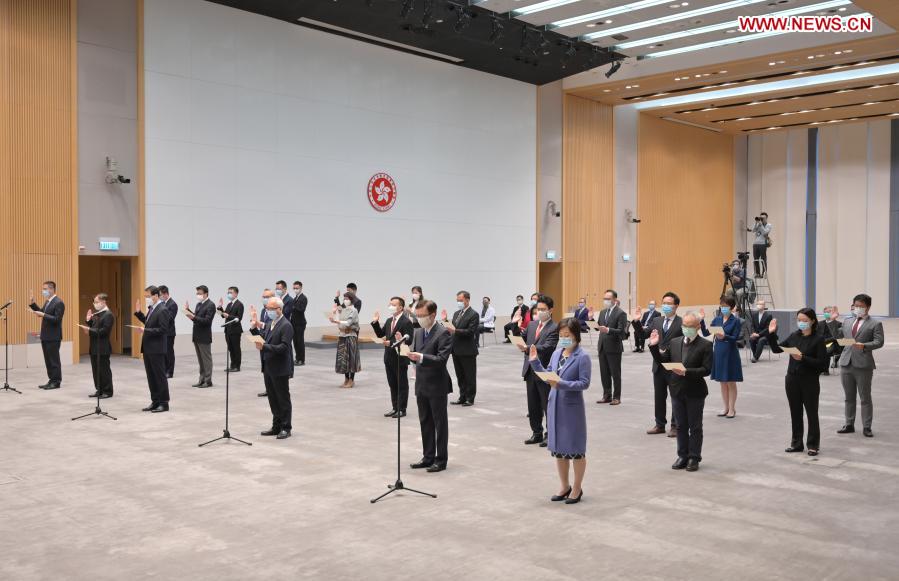 All the 12 under secretaries and 14 political assistants swear to uphold the Basic Law of the Hong Kong Special Administrative Region (HKSAR) of the People's Republic of China (PRC) and swear allegiance to the HKSAR of the PRC during an oath-taking ceremony in Hong Kong, south China, Dec. 16, 2020. The HKSAR government held an oath-taking ceremony for under secretaries and political assistants, witnessed by the HKSAR Chief Executive Carrie Lam on Wednesday. (Xinhua)