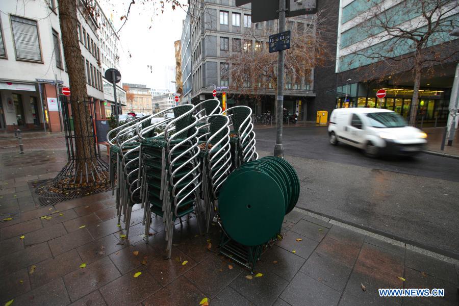 Stacked chairs of a closed restaurant are seen in Frankfurt, Germany, on Dec. 16, 2020. Germany will go into stricter lockdown from Wednesday, closing non-essential shops and limiting the size of private gatherings, Chancellor Angela Merkel and regional leaders agreed on Sunday. The tighter restrictive measures, which will be effective until Jan. 10, were in response to an 