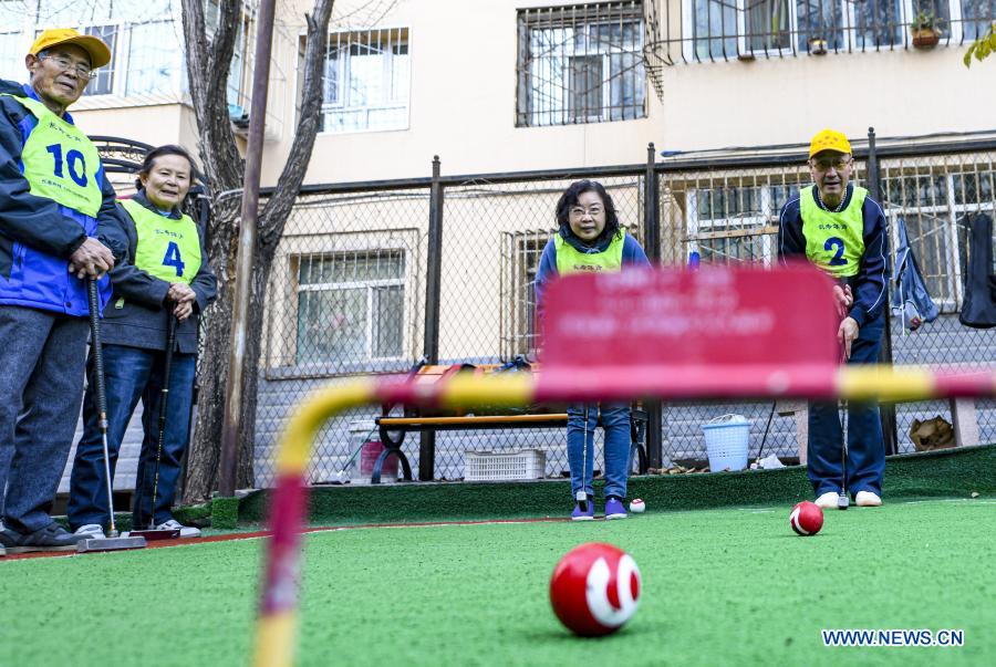 Ge Fugui (1st R), a 66-year-old gateball aficionado, enjoys a friendship game with teammates in Urumqi, northwest China's Xinjiang Uygur Autonomous Region, Oct. 23, 2020. The year 2020 is a juncture where China is wrapping up the plan for the 2016-2020 period and preparing for its next master plan. In 2020, China stepped up efforts to shore up weak links regarding people's livelihoods. A slew of measures has been rolled out to address people's concerns in employment, education, basic medical services, the elderly care, housing, public services, etc. (Xinhua/Ma Kai)