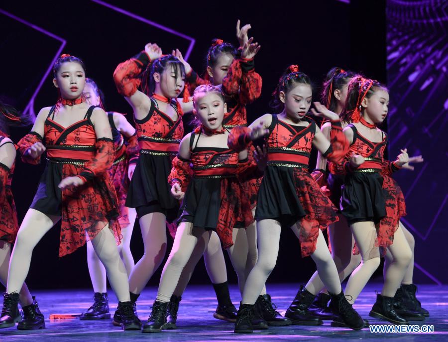 Dancers from Nanping City of Fujian Province perform during the finals of a cross-Strait Hip Hop dance championship for teenagers in Fuzhou, southeast China's Fujian Province, Dec. 20, 2020. The final round of the championship kicked off here on Sunday, with teenagers from both sides of the Taiwan Strait attending the competition on-site or on-line. (Xinhua/Song Weiwei)