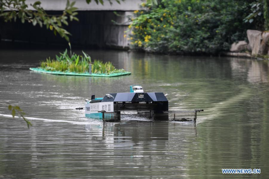 An unmanned patrolling and waste-collecting machine works in a river in Hangzhou, east China's Zhejiang Province, Oct. 21, 2020. With the development of new technologies such as the 5G, artificial intelligence and BeiDou Navigation Satellite System (BDS), unmanned technology is injecting impetus into traditional industries as well as making people's life easier and more convenient in China, and bringing about profound innovation and transformation. From commerce, agriculture, transportation, industrial production to environmental protection, China has been embracing this emerging technology in various fields in recent years as it strives to promote high-quality development. (Xinhua/Xu Yu)