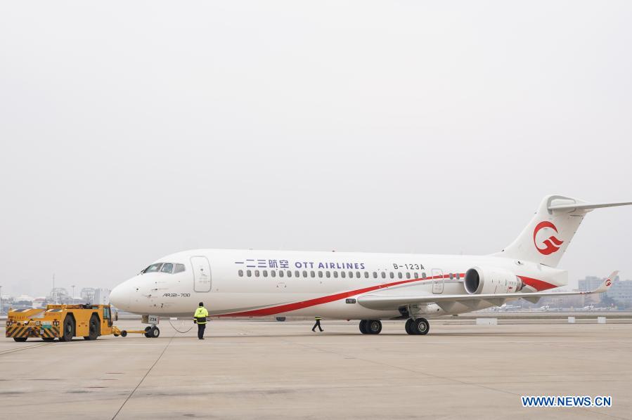 An ARJ21 jetliner of One Two Three Airlines (OTT Airlines) heads for designated area before performing its first flight at Shanghai Hongqiao International Airport in Shanghai, east China, Dec. 28, 2020. The ARJ21 is China's first turbo-fan regional passenger jetliner manufactured by the Commercial Aircraft Corporation of China (COMAC). OTT Airlines, a subsidiary of China Eastern Airlines, is the last among seven airlines to officially operate ARJ21 jetliner in China. (Xinhua/Ding Ting)