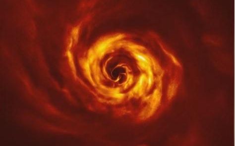 围绕御夫座AB星旋动的圆盘内出现“扭曲”,科学家认为那是行星正在形成的位置。
