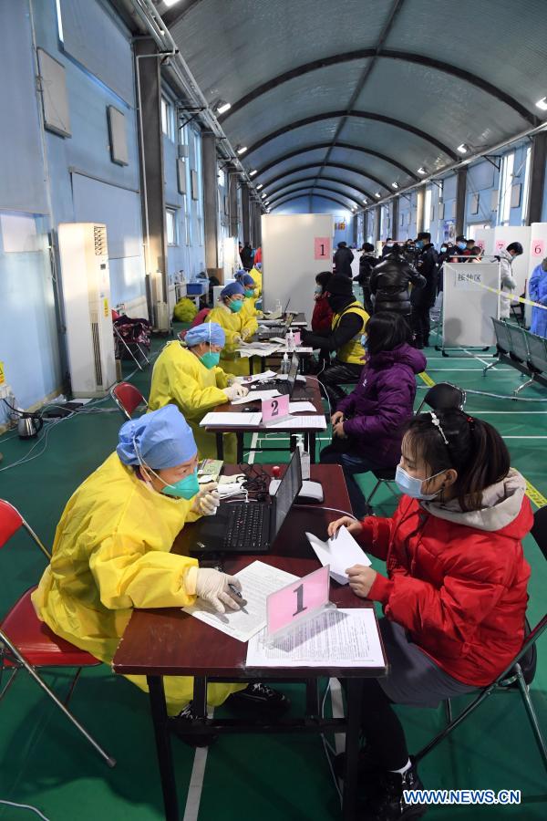 People register for their COVID-19 vaccinations at a temporary vaccination site in Haidian District of Beijing, capital of China, Jan. 6, 2021. (Xinhua/Ren Chao)