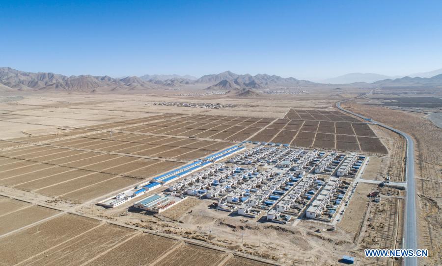 Aerial photo taken on Jan. 14, 2021 shows the community for poverty alleviation relocation in Gajilin Village of Chaqiug Township in Sa'gya County of Xigaze, southwest China's Tibet Autonomous Region. Residents who were relocated from poverty-stricken area celebrate the farmers' New Year in their new homes in Gajilin Village. In Xigaze and other farming regions of Tibet, people celebrate New Year on the 1st day of the twelfth month of the Tibetan lunar calendar. According to local farming tradition, spring ploughing season always begins as the fall of New Year, thus celebrating one month earlier is to meet the needs of local agriculture. Xigaze City is regarded as a granary of Tibet. (Xinhua/Sun Fei)